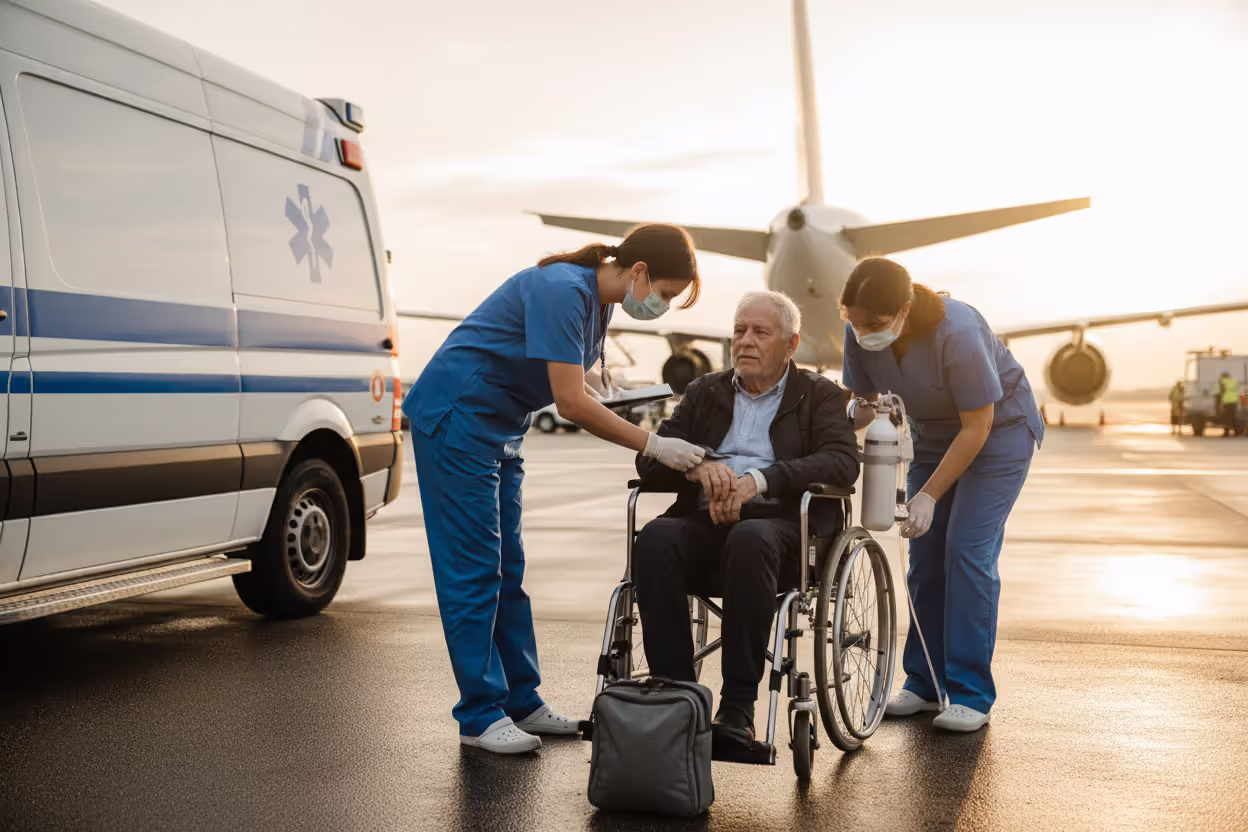 Senior traveler receiving medical assistance during an emergency transfer